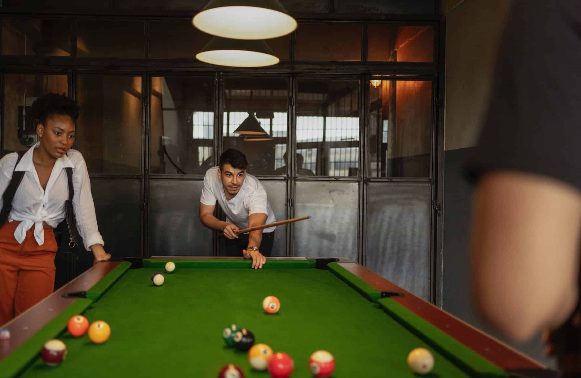 people playing billiard